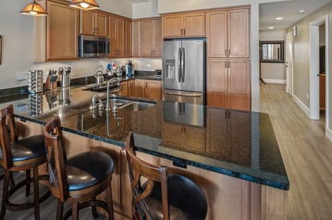 The kitchen is fully appointed with additional counter seating.