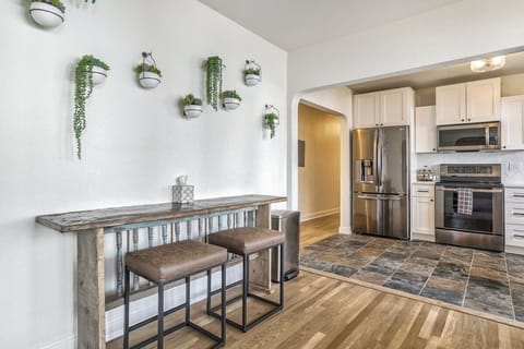 Unit A: Circle around for home-cooked food or delicious takeout around table with plenty of open light flowing in!