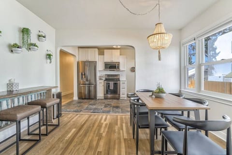 Unit A: Circle around for home-cooked food or delicious takeout around table with plenty of open light flowing in!