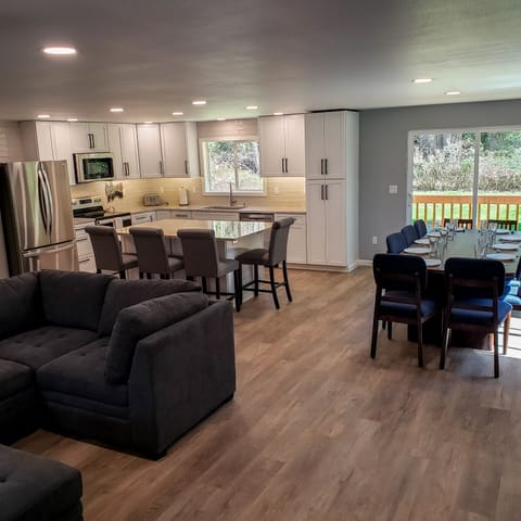 Living room, dining room and kitchen feature an open concept perfect to gather.