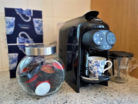 Lavazza coffee machine producing Espresso or Capuccino with the touch of a button