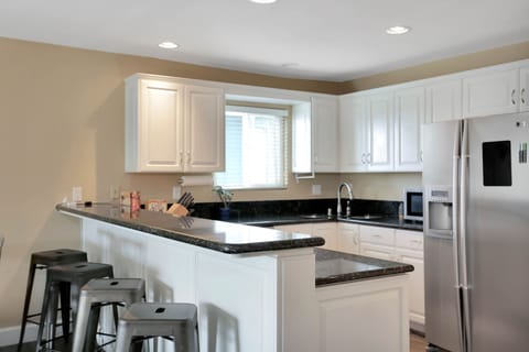 Fully Equipped with Breakfast Bar, perfect for casual dining.