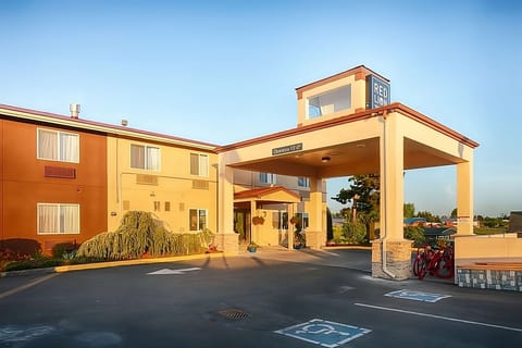 Arrive with ease under the covered entrance and warm lighting.