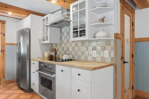 Cook, gather, and make memories in the fully stocked kitchen! With modern amenities and rustic charm, it's ready for any feast.