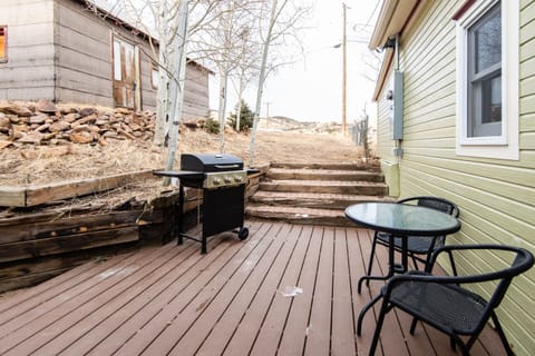 The private back patio has a grill and seating area