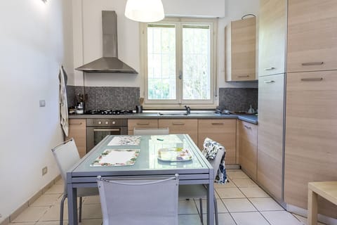 Fridge, oven, dishwasher, dining tables