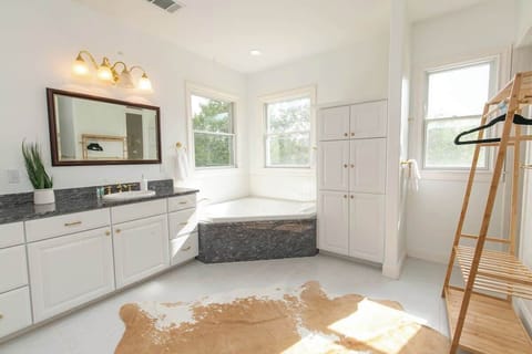 Soak after a long day in the master bathroom tub.