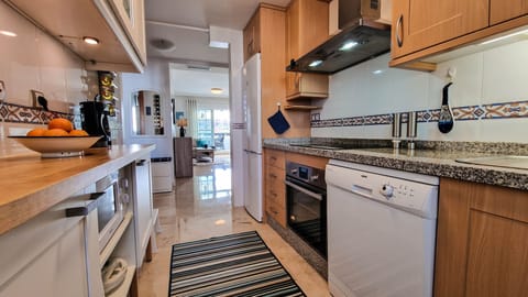 Kitchen to hall & living room. Dishwasher & washing machine tablets provided