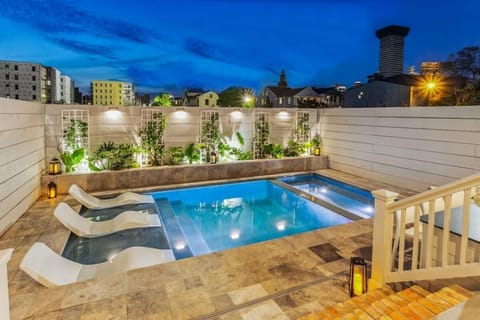 A heated pool, sun loungers