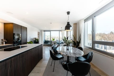 Expansive living space with stylish furnishings and ample light.