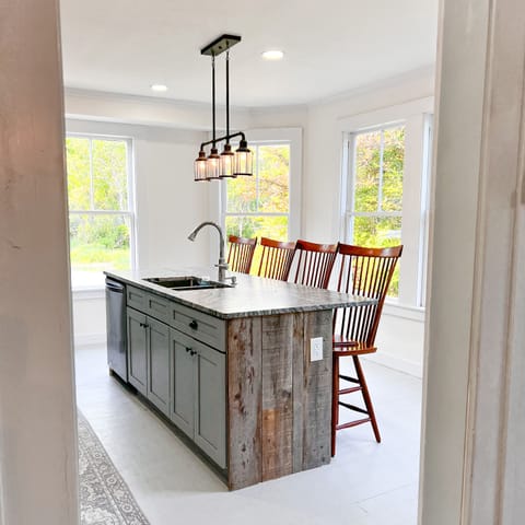 Views of the kitchen island from the gathering room table