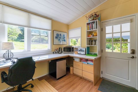 You'll find many uses for this multi-functional office/sunroom, inspiring views.