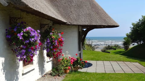 Thatcher's Rest Cottage with stunning sea views.