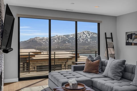 Enjoy incredible views from the couch in this comfortable and spacious living room area.