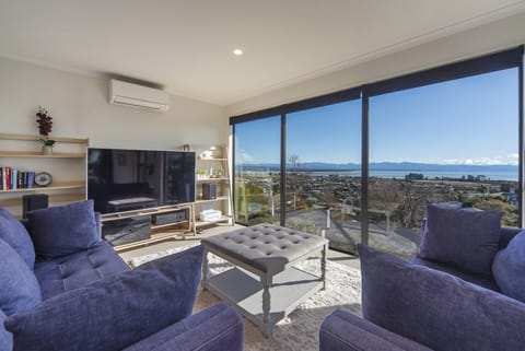 Sunny living area with stunning views over Tasman Bay!