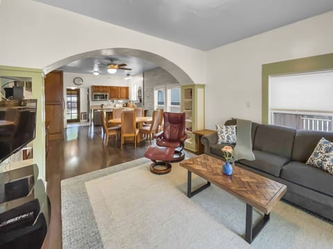 Cozy living room with smart tv, some books and games. 