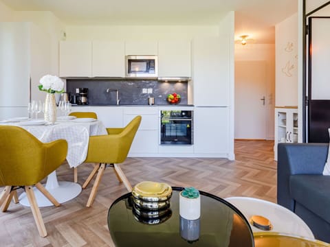 Furniture, Table, Property, Cabinetry, Interior Design, Wood, Couch, Yellow, Flooring, Floor