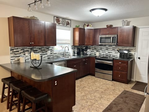 Kitchen with all the desired cooking and baking pots and pans.