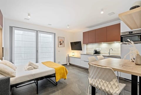 A modern kitchen to inspire your culinary creativity, complete with cozy dining space.