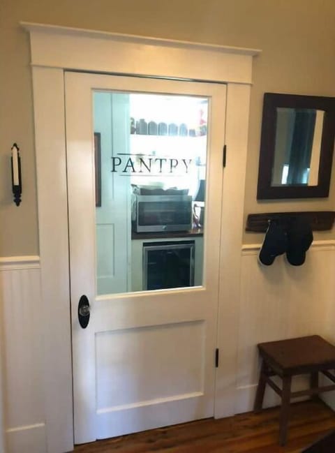 Working pantry with coffee pot, microwave, and wine refrigerator 