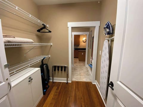 Looking back the other way from the walk-in closet, through the laundry area, and into the kitchen. This floor plan is super convenient!