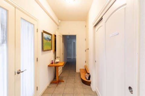 Living room entrance on the left, bathroom, laundry and bedroom 2 beyond.