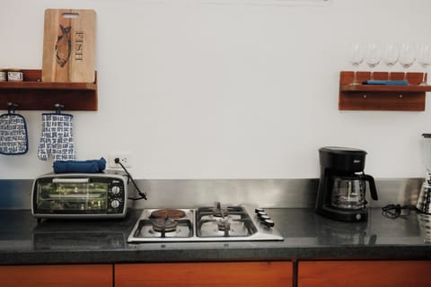 Fridge, stovetop, coffee/tea maker, cookware/dishes/utensils