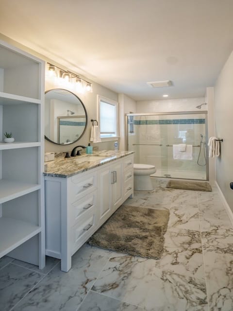 Combined shower/tub, hair dryer, towels, soap