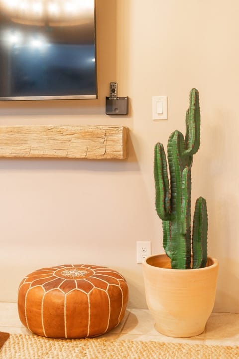 Living room with 85" smart TV and fireplace