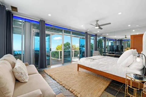 Wake up to the sound of the ocean and views that stretch to the horizon. Plush pillows on the comfortable bed and the neutral rug beneath your feet create the perfect space to relax and take it all in.