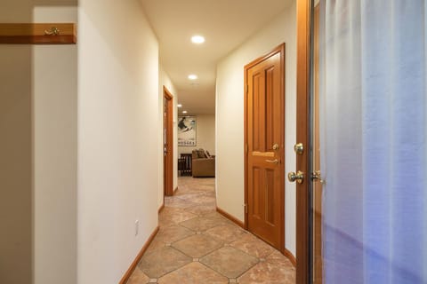 A welcoming hallway leading to the home’s comfortable bedrooms.