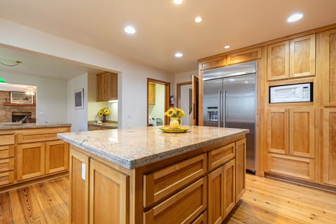The gourmet kitchen is fully equipped for all your cooking needs.
