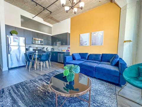 Spacious living room with a lot of natural light and large windows