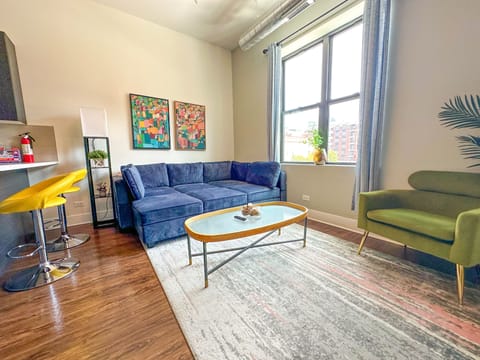 Spacious living room with a lot of natural light and large windows.