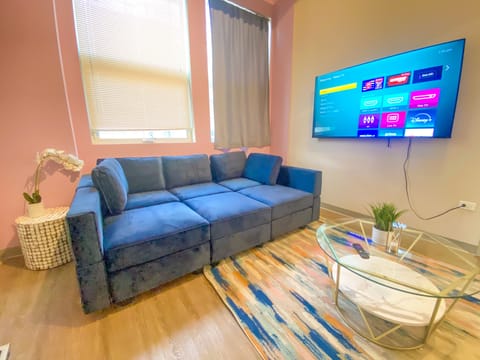 Spacious living room with a lot of natural light and large windows