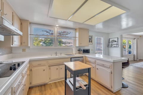 Fully stocked kitchen with bar stool seating