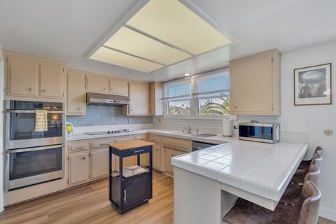 Fully stocked kitchen with bar stool seating