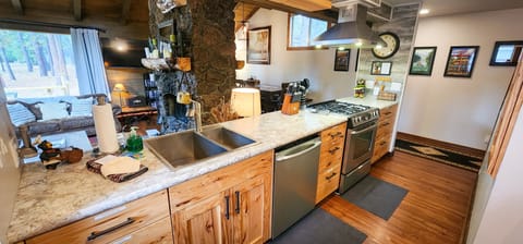 Fully stocked kitchen overlooking living and dinning rooms