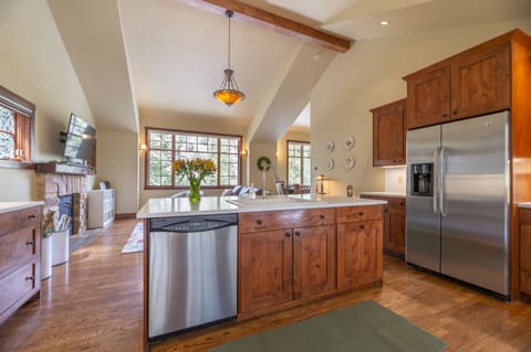 Alder wood cabinets, quartz countertops and stainless steel appliances