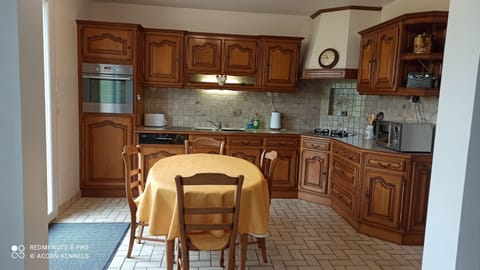 Spacious well equipped kitchen with patio doors to the back garden