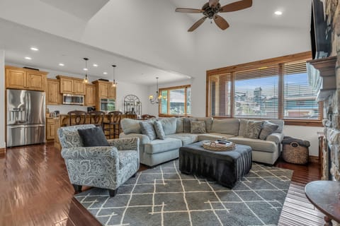 Decompress on the cozy couch in front of the fireplace or pull up at the breakfast nook for a quick chat with your travel companions in this second-floor living, dining, and kitchen area.
