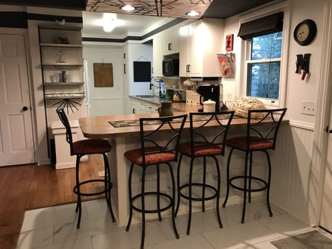 Eat-in kitchen, full size appliances, all your plates, flatware and more.