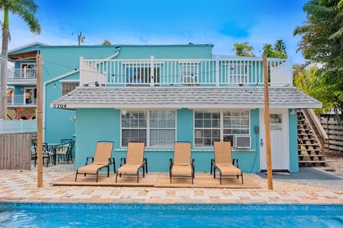 A heated pool, sun loungers