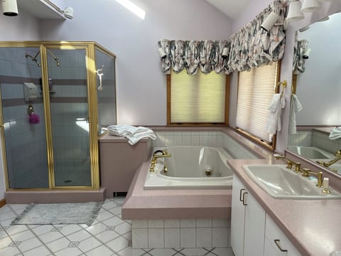 Shower, jetted tub, towels, soap