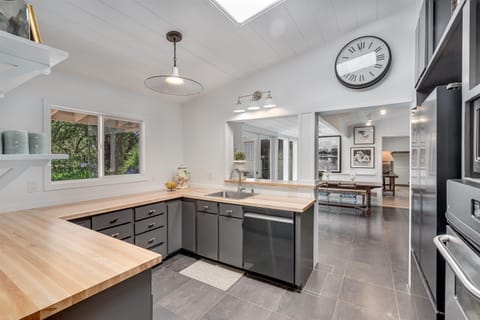 Kitchen with view into additional dining and large family room