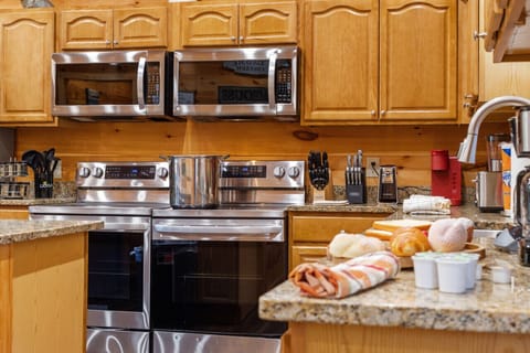 Prepare gourmet meals in this spacious kitchen, complete with double ovens and all the tools you need for a culinary adventure.