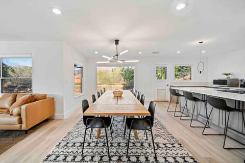 Open design of the home connects the living room, the dining room, and the kitchen area