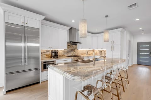 Extra seating at the bar and a drip coffee maker