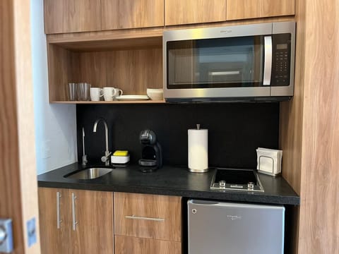 Fridge, microwave, stovetop, coffee/tea maker