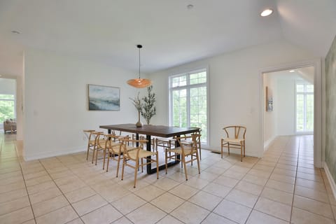 Formal dining room with large table and room for more tables or chairs. seats 8